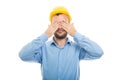 Young architect with yellow helmet covering eyes Royalty Free Stock Photo