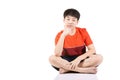 Portrait Young Asian boy sitting over white background Royalty Free Stock Photo