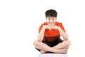 Portrait Young Asian boy sitting over white background Royalty Free Stock Photo