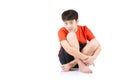 Portrait Young Asian boy sitting over white background Royalty Free Stock Photo