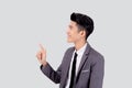 Portrait young asian business man pointing and presenting isolated on white background, advertising and marketing. Royalty Free Stock Photo