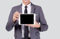 Portrait young asian business man showing and presenting tablet computer with blank with success isolated. Royalty Free Stock Photo