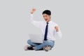 Portrait young asian business man sitting work on laptop computer to internet online isolated white background. Royalty Free Stock Photo