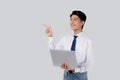 Portrait young asian business man standing work on laptop computer to internet online isolated white background. Royalty Free Stock Photo