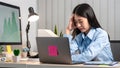 Portrait of young asian business woman feeling stress and tired from work sitting on the chair about constant headaches a migraine Royalty Free Stock Photo