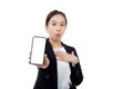 Portrait young asian business woman showing and presenting smartphone with blank with mockup isolated. Royalty Free Stock Photo