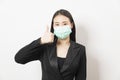 Portrait young Asian business woman in suit wearing face mask Royalty Free Stock Photo