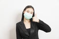 Portrait young Asian business woman in suit wearing face mask Royalty Free Stock Photo