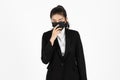 Portrait young Asian business woman in suit wearing face mask on white isolated background. Coronavirus flu virus , Covid 19 , Air Royalty Free Stock Photo