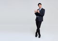 Portrait of young Asian businessman hand pointing up to copy space isolated on studio white background Royalty Free Stock Photo