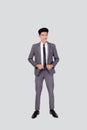 Portrait young asian businessman in suit smiling with confident and friendly isolated on white background. Royalty Free Stock Photo