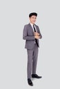 Portrait young asian businessman in suit smiling with confident and friendly isolated on white background. Royalty Free Stock Photo