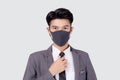 Portrait young asian businessman in suit wearing face mask for protective covid-19 isolated on white background. Royalty Free Stock Photo