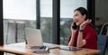 Portrait young asian businesswoman beautiful charming smiling and talking on the mobile phone in the office. female Royalty Free Stock Photo