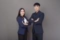 Portrait of young Asian confidence business people on gray background