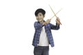 A portrait of a young Asian elementary school student and a drumstick