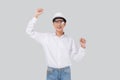 Portrait young asian engineer man wearing helmet excited isolated white background, male is architect or contractor. Royalty Free Stock Photo