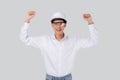 Portrait young asian engineer man wearing helmet excited isolated white background, male is architect or contractor with glad. Royalty Free Stock Photo