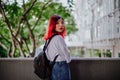 Portrait of young Asian fashionista girl student with red hair Royalty Free Stock Photo