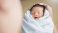 Portrait of young asian father or mother with healthy newborn baby. Royalty Free Stock Photo