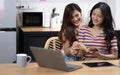 Portrait of young Asian female lovers reading book and spending happy time together, LGBT concept Royalty Free Stock Photo