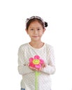 Portrait of young Asian girl child holding artificial flower giving for you isolated over white background Royalty Free Stock Photo