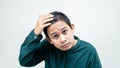 A portrait of young Asian Malay checking hair loss condition on his head Royalty Free Stock Photo