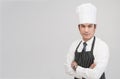 Portrait of young Asian male chef looks straight to the camera isolated in grey background with copy space, concept portrait of