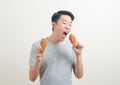 Young Asian man with fried chicken on hand Royalty Free Stock Photo