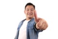 Portrait of young Asian man shows thumbs up sign, happy smiling person, OK deal Royalty Free Stock Photo