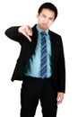 Portrait of Young Asian man smiling standing wearing black suit and pointing thumbs down isolated on a white background. Concept Royalty Free Stock Photo