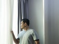 Man Thinking and Looking Out the Windows Royalty Free Stock Photo