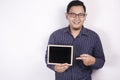 Young Asian Man Smiling and Presenting Empty Copy Space Blackboard Royalty Free Stock Photo