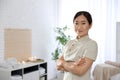 Portrait of young Asian masseuse in spa salon Royalty Free Stock Photo