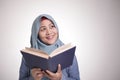 Muslim Woman Reading Book and Thinking Royalty Free Stock Photo