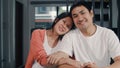 Portrait young Asian Pregnant couple relax toothy smile looking to camera at home. Mom and Dad feeling happy funny peaceful while Royalty Free Stock Photo