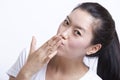 Portrait of young Asian woman blowing kiss against white background Royalty Free Stock Photo