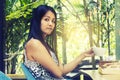 Portrait young asian woman drinking hot green tea latte in coffee shop. Royalty Free Stock Photo