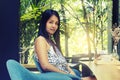 Portrait young asian woman drinking hot green tea latte in coffee shop. Royalty Free Stock Photo