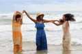 portrait of young asian woman with happiness emotion wearing beautiful dress dancing on sea beach and laughing joyful use for Royalty Free Stock Photo