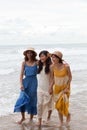 portrait of young asian woman with happiness emotion wearing beautiful dress walking on sea beach and laughing joyful use for Royalty Free Stock Photo