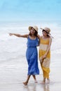 Portrait of young asian woman with happiness emotion wearing beautiful dress walking on sea beach and laughing joyful use for Royalty Free Stock Photo