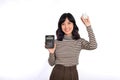 Portrait of young Asian woman casual uniform holding white piggy bank and calculator isolated on white background, Financial and Royalty Free Stock Photo