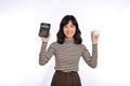 Portrait of young Asian woman casual uniform holding white piggy bank and calculator isolated on white background, Financial and Royalty Free Stock Photo