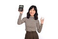 Portrait of young Asian woman casual uniform holding white piggy bank and calculator isolated on white background, Financial and Royalty Free Stock Photo