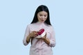 Portrait of a young asian woman opens a heart shape gift box. Royalty Free Stock Photo