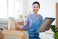 Happy Asian Woman Posing in New Home Royalty Free Stock Photo