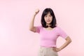 Portrait young asian woman proud and confident showing strong muscle strength arms flexed posing, feels about her success Royalty Free Stock Photo