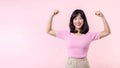 Portrait young asian woman proud and confident showing strong muscle strength arms flexed posing, feels about her success