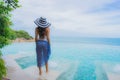 Portrait young asian woman relax smile happy around outdoor swimming pool in hotel resort with sea ocean view Royalty Free Stock Photo